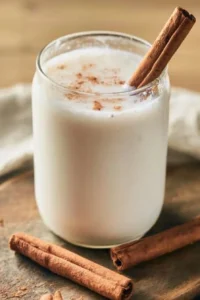A glass of Classic Mexican Horchata on a wooden table.