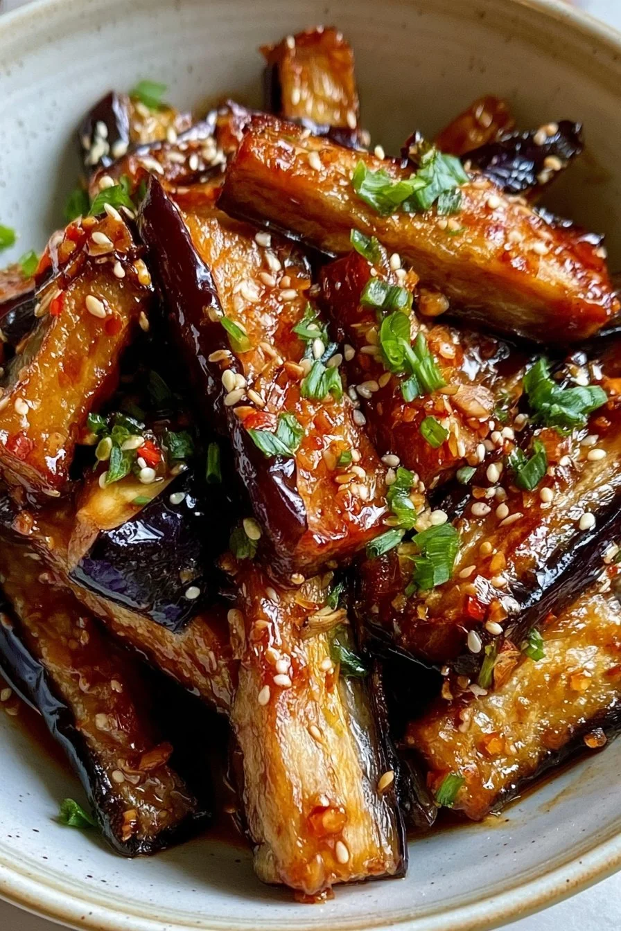 Crispy eggplant in garlic soy glaze served on a plate
