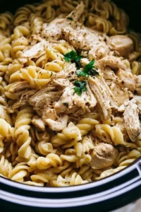 Crockpot Garlic Parmesan Chicken Pasta served in a bowl, ready for dinner party