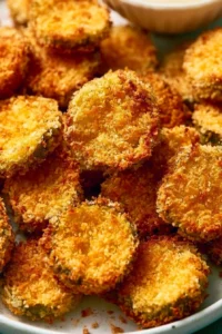 Crispy air fryer fried pickles served with a dipping sauce
