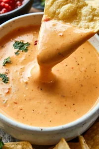 Easy copycat Chili's queso dip recipe with melted cheese and spices.