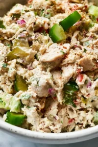 High protein creamy chicken salad with fresh ingredients in a bowl