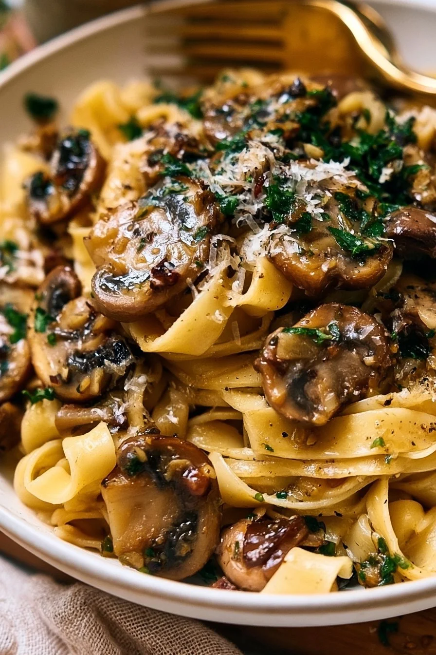 Delicious Garlic Mushroom Pasta garnished with fresh herbs