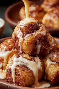 Gooey sourdough discard cinnamon roll bites on a plate