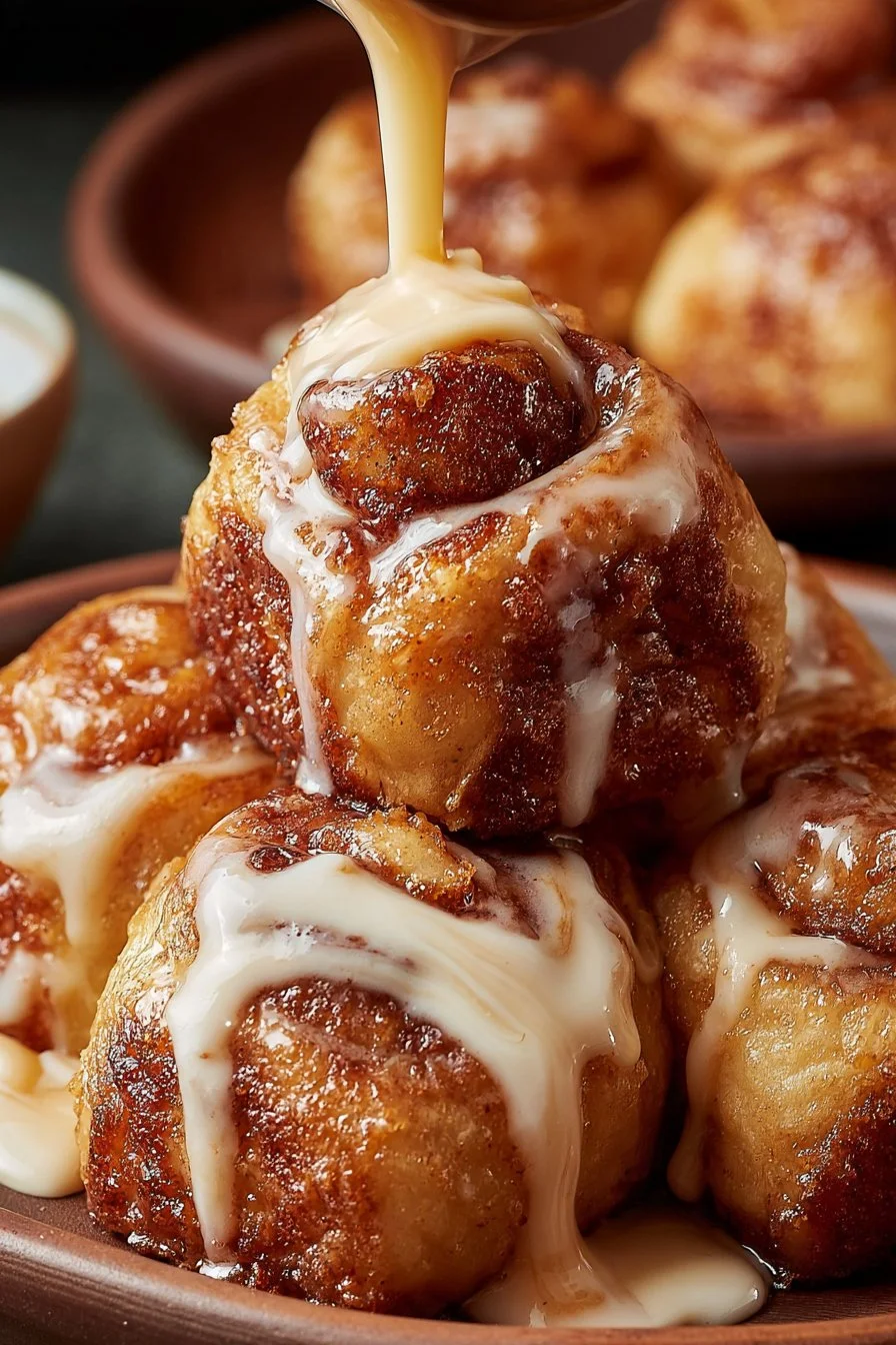 Gooey sourdough discard cinnamon roll bites on a plate