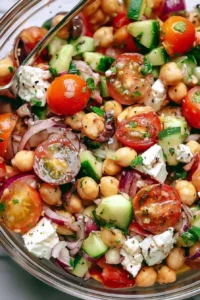 Bowl of Greek Chickpea Salad with fresh vegetables and feta cheese