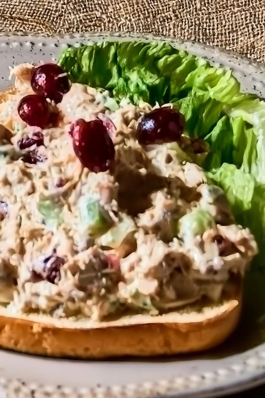 Home 27 Healthy Cranberry Tuna Salad with cranberries, tuna, and greens in a bowl