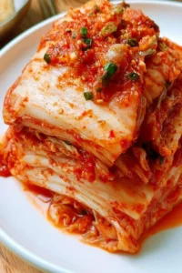 Bowl of homemade Napa Cabbage Kimchi with vibrant colors and spices