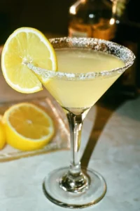 Glass of Lemon Drop Martini garnished with lemon slice and sugar rim