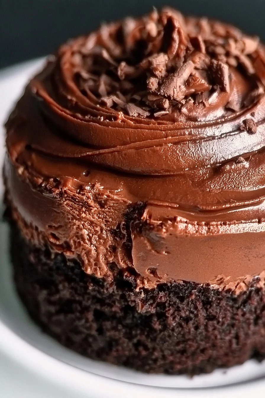Delicious mini chocolate cake topped with creamy frosting and sprinkles