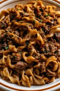 One-Pan Beef & Noodles dish served in a bowl, showcasing tender beef and pasta.