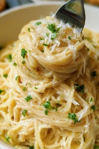 Plate of One Pot Garlic Parmesan Pasta with herbs and grated cheese