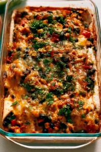 Delicious protein-packed burrito bake topped with cheese and fresh ingredients