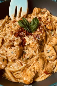 Creamy Marry Me Chicken Pasta served in a bowl with herbs and parmesan.