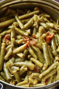 Southern-Style canned green beans in a serving dish with seasoning.