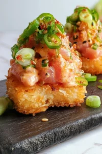Delicious spicy tuna crispy rice served as a sushi-inspired appetizer